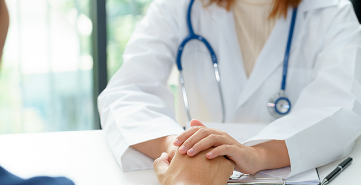 Doctor holding someone's hand