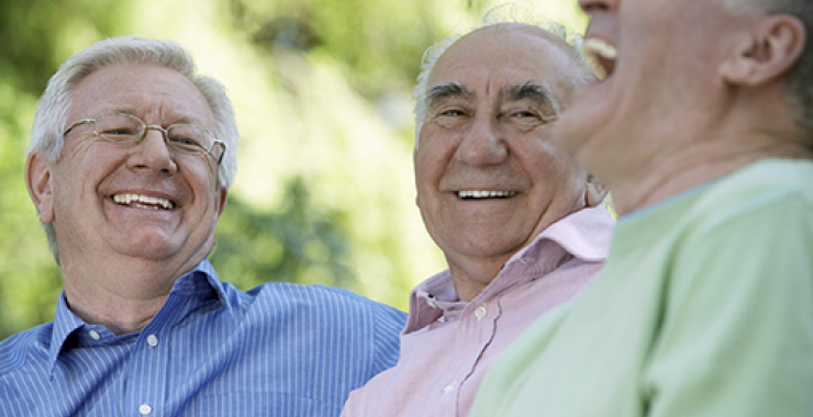 Group of older men laughing with each other